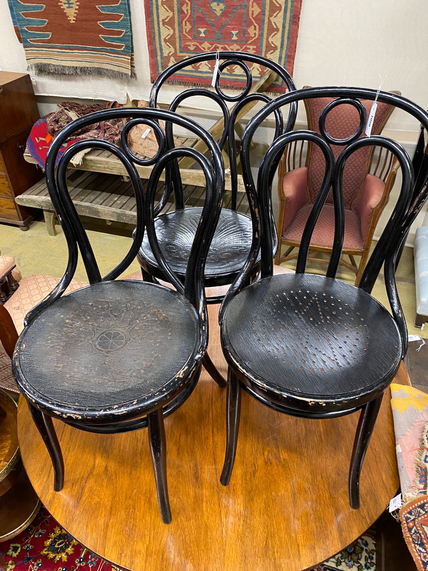 A set of three Thonet ebonised bentwood chairs